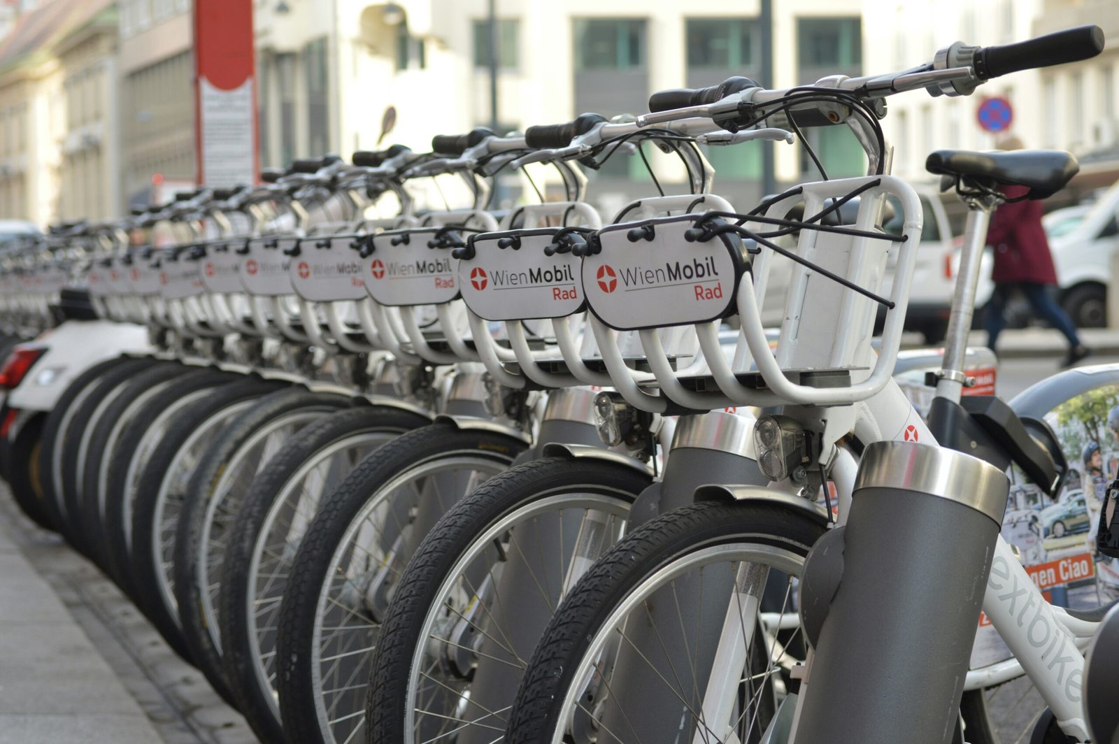 a row of bicycles A row of bicycles parked next to each other